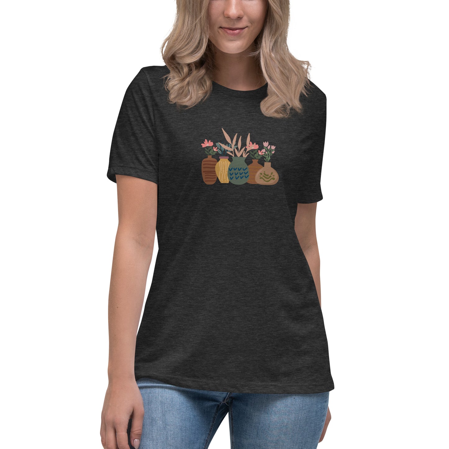 Woman wearing a dark athletic grey relaxed tee with a charming vase floral graphic design, embodying comfortable and authentic fashion by BYOL.