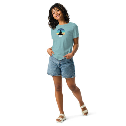 Woman in heather blue t-shirt with Zen sunset graphic