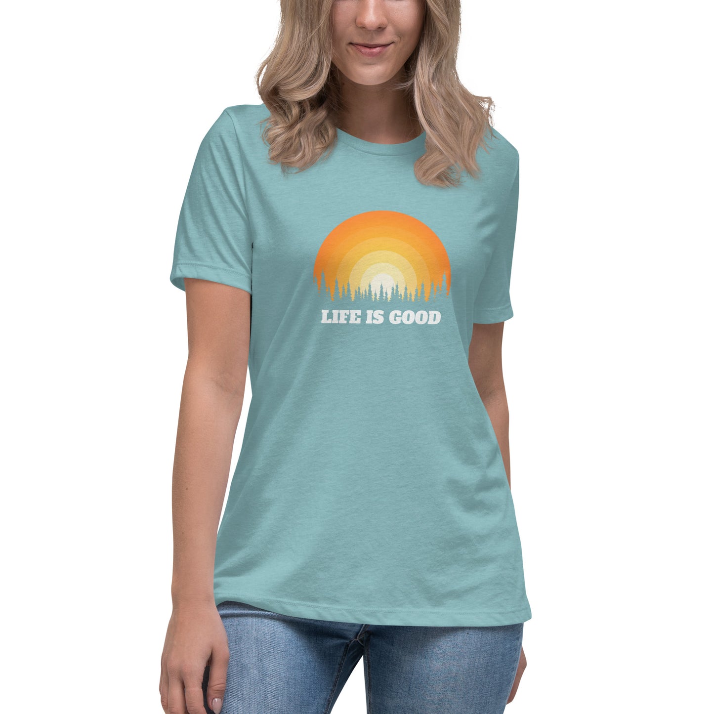 Woman in heather blue relaxed t-shirt with 'Life Is Good' sunset graphic