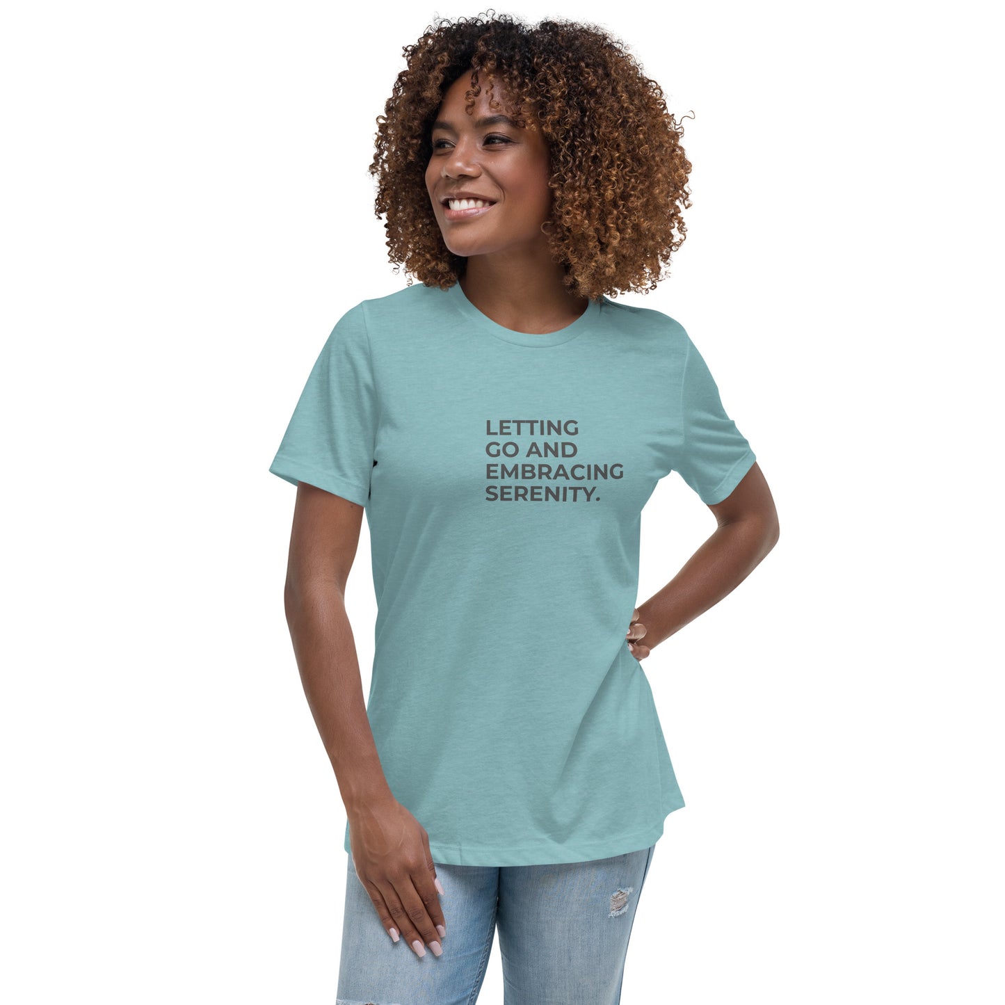 Woman wearing a lagoon blue relaxed tee with "Letting Go and Embracing Serenity" printed, available in various colors and sizes from S-3XL.