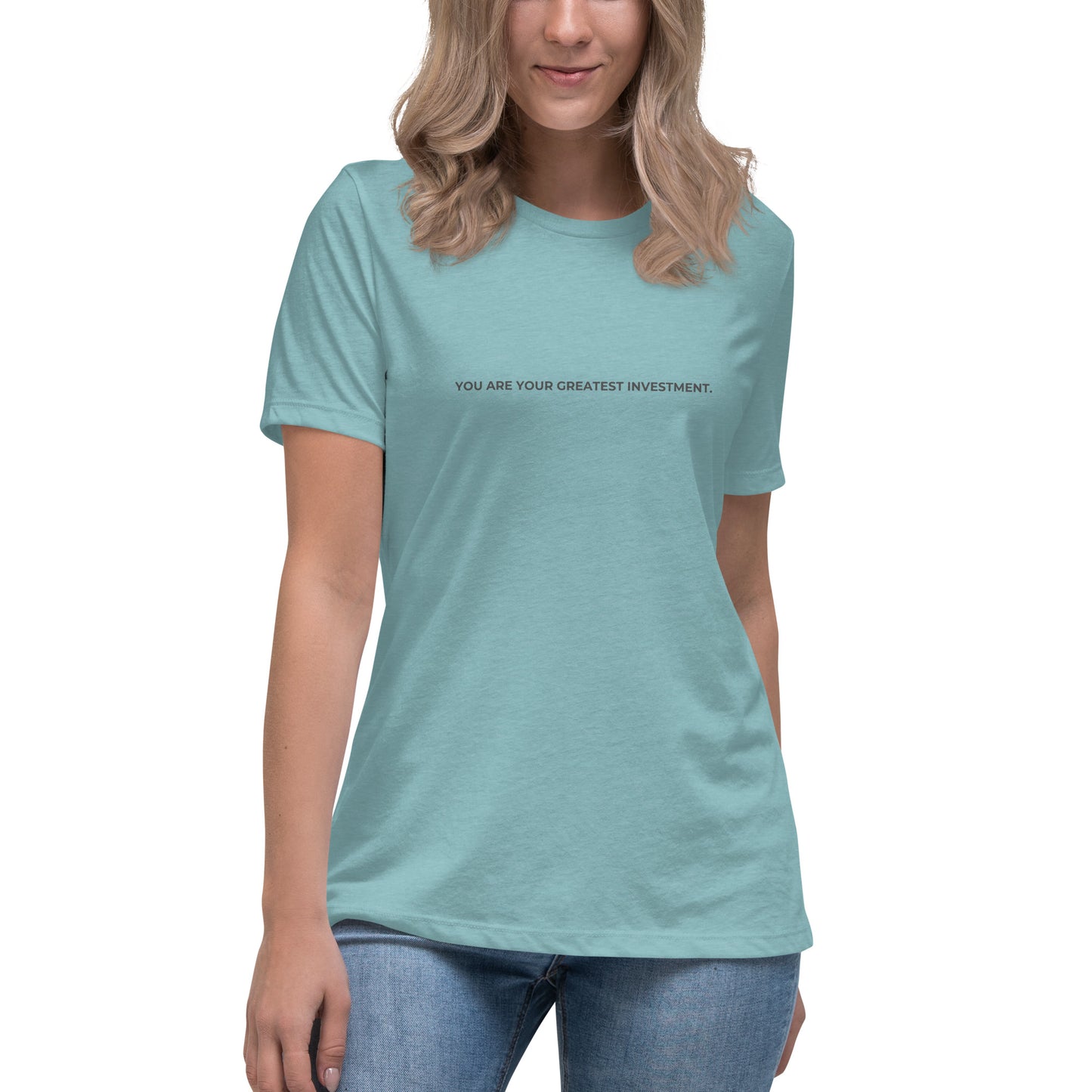 Woman wearing a heather blue lagoon relaxed tee with "You Are Your Greatest Investment" printed.