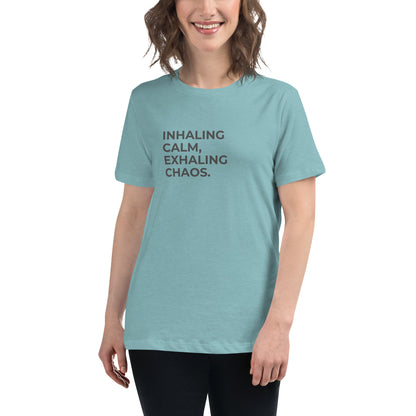 Woman wearing a heather blue lagoon relaxed tee with "Inhaling Calm, Exhaling Chaos" printed.