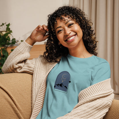 Woman wearing a heather blue lagoon relaxed tee with a tranquil night sky graphic design, representing comfortable and authentic fashion by BYOL.