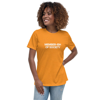 Smiling woman wearing a heather orange relaxed t-shirt with 'Member-ish of Society' slogan