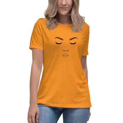 Woman wearing a heather orange relaxed t-shirt featuring a minimalist face design