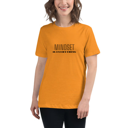 Woman wearing a heather orange relaxed t-shirt with the phrase "Mindset is Everything" printed in black.