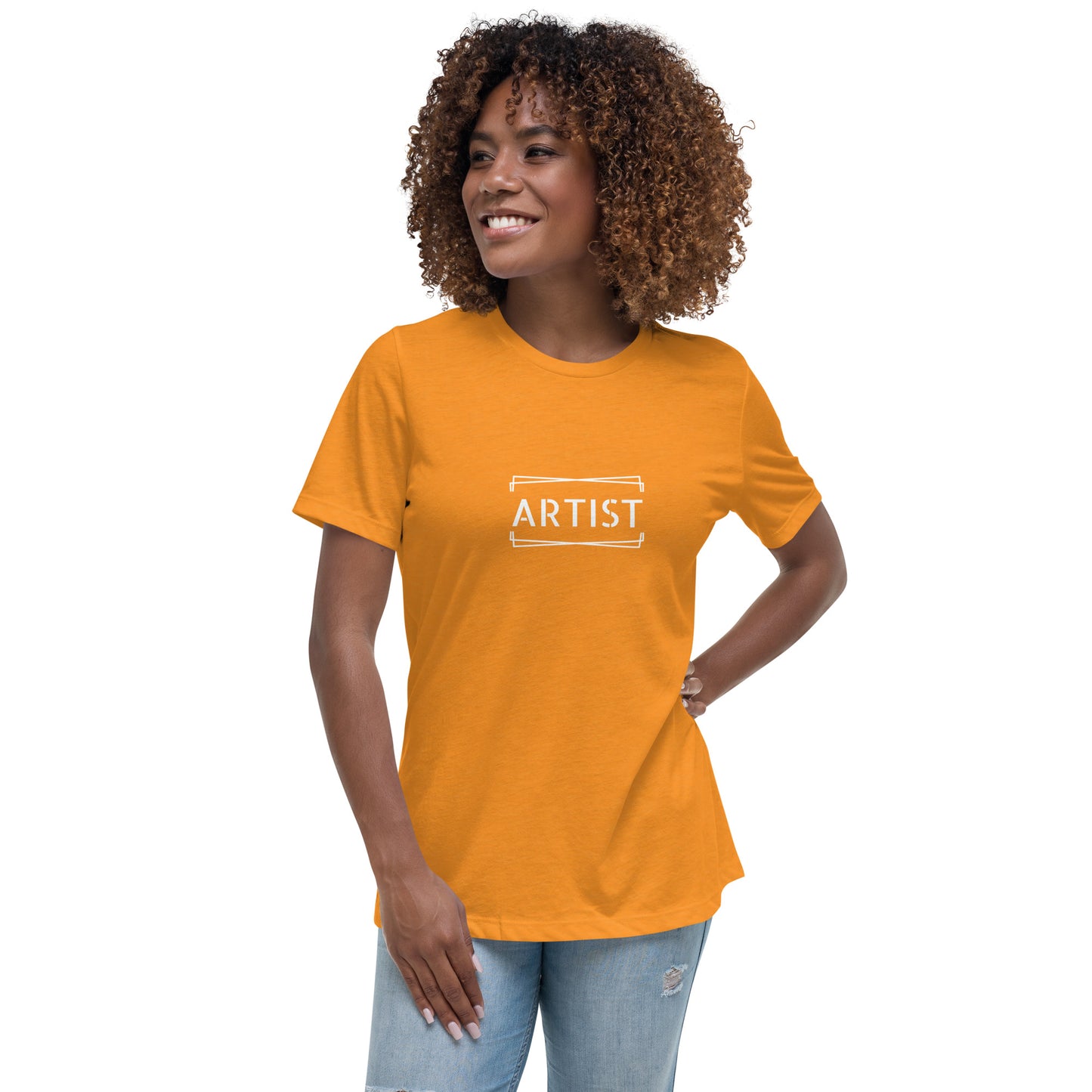 Woman wearing a heather orange relaxed t-shirt labeled 'ARTIST'