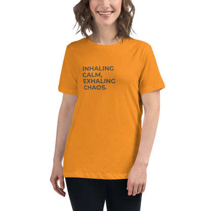 Woman wearing a heather marmalade relaxed tee with "Inhaling Calm, Exhaling Chaos" printed.