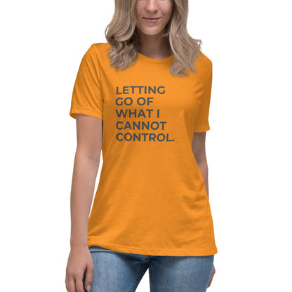 Woman wearing a heather marmalade relaxed tee with "Letting Go of What I Cannot Control" printed.