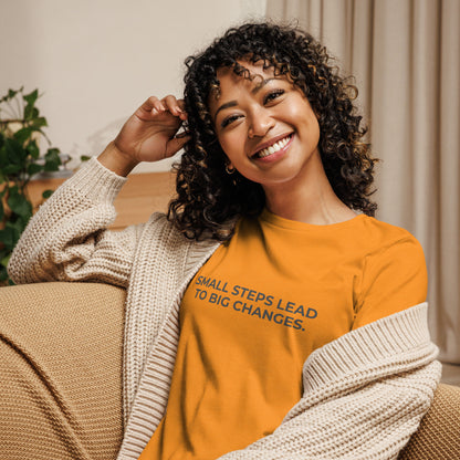 Woman wearing an marmalade relaxed tee with "Small Steps Lead to Big Changes" printed.