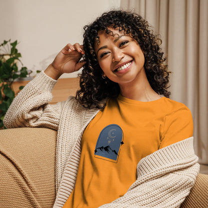 Woman wearing a marmalade relaxed tee with a tranquil night sky graphic design, representing comfortable and authentic fashion by BYOL.