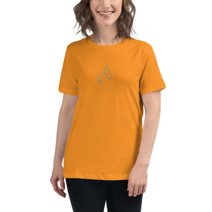 Woman wearing a heather marmalade relaxed tee with a minimalist flower graphic design, embodying comfortable and authentic fashion by BYOL.