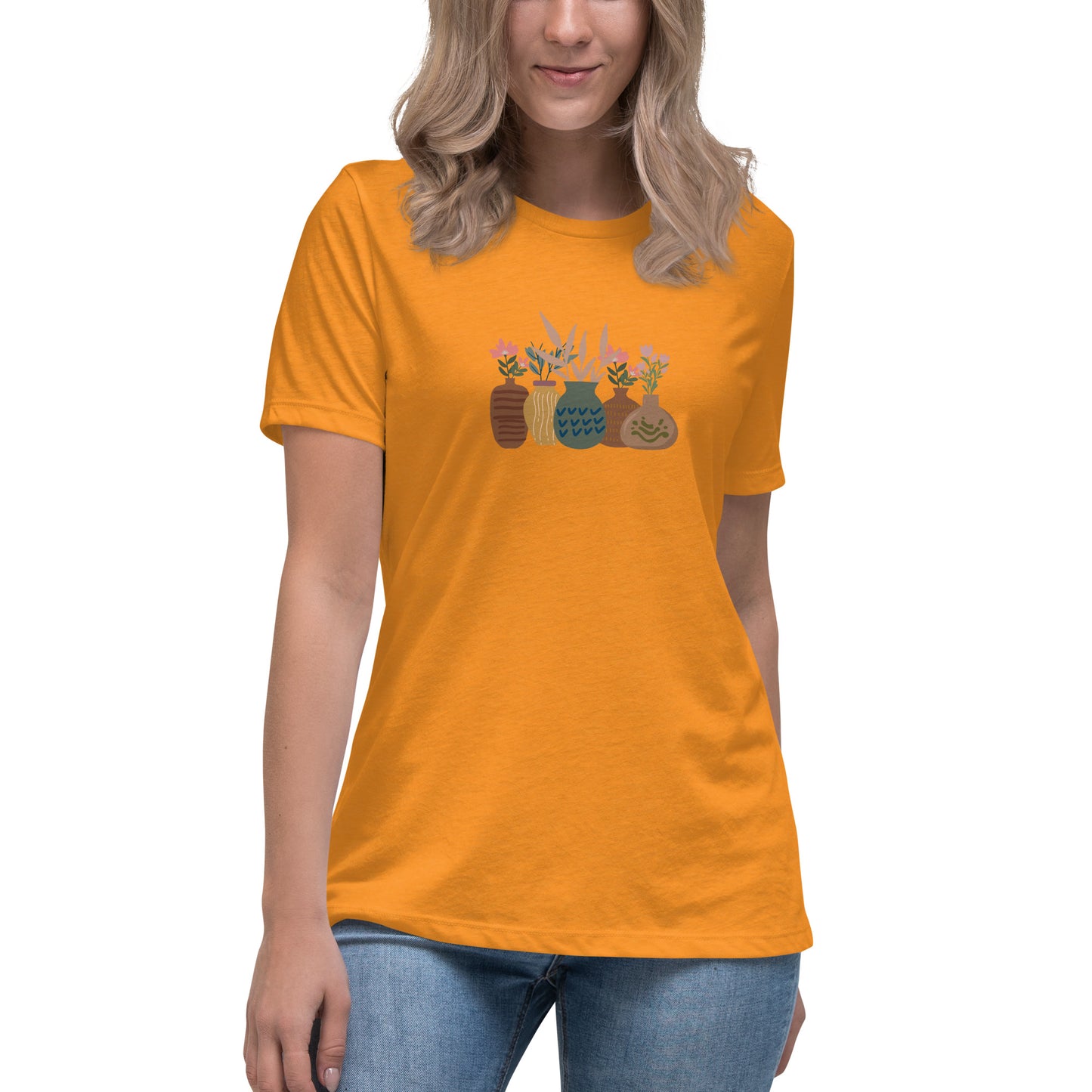 Woman wearing a  heather marmalade relaxed tee with a charming vase floral graphic design, embodying comfortable and authentic fashion by BYOL.