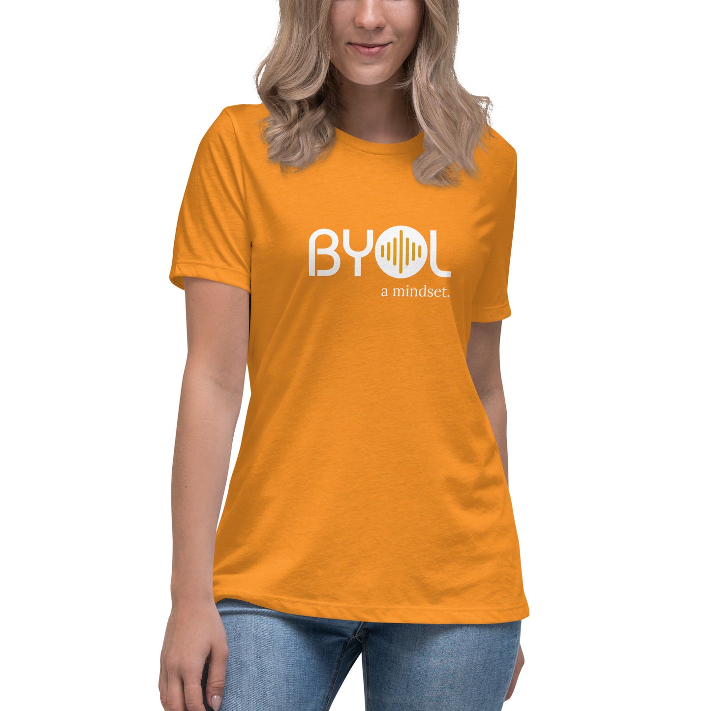 Woman wearing a heather marmalade relaxed fit BYOL mindset t-shirt  with color options in black, pink, blue, and gray, available in sizes S to 3XL.