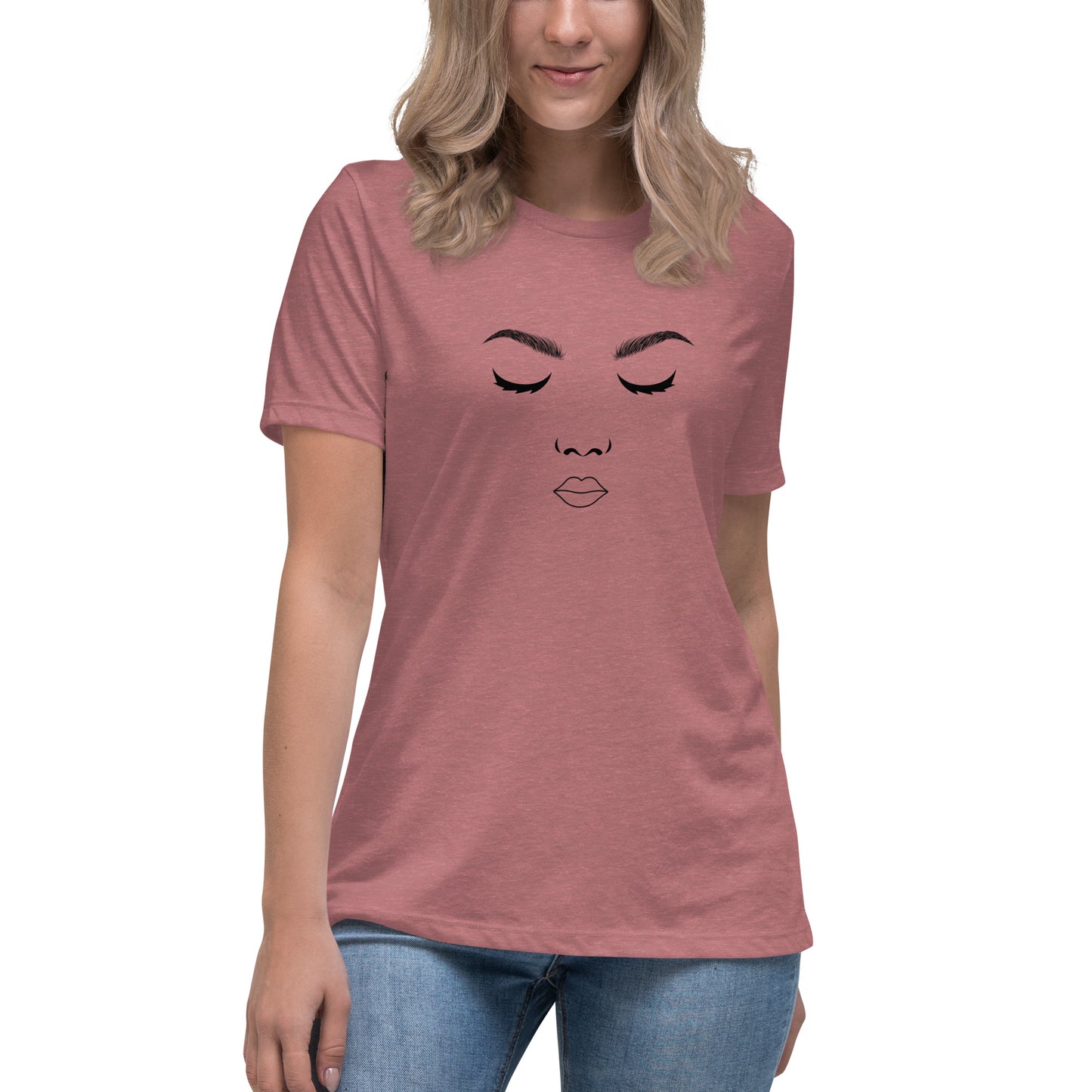 Woman wearing a heather mauve relaxed t-shirt featuring a minimalist face design