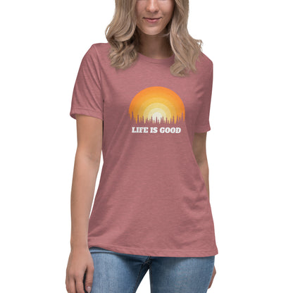 Woman in heather mauve relaxed t-shirt with 'Life Is Good' sunset graphic