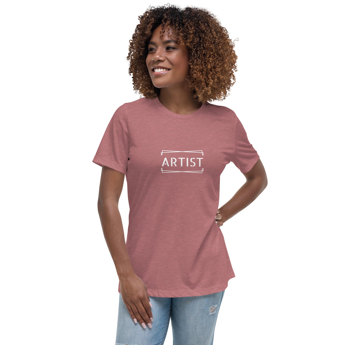 Woman wearing a heather mauve relaxed t-shirt labeled 'ARTIST'