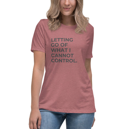 Woman wearing a heather mauve relaxed tee with "Letting Go of What I Cannot Control" printed.