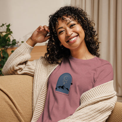 Woman wearing a heather mauve relaxed tee with a tranquil night sky graphic design, representing comfortable and authentic fashion by BYOL.