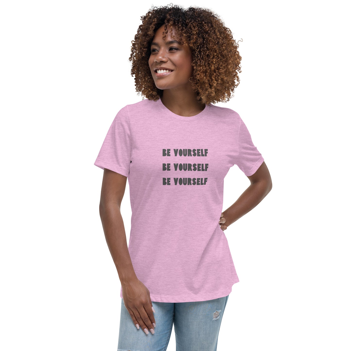 Smiling woman wearing a heather lilac relaxed t-shirt with 'Be Yourself' text repeated