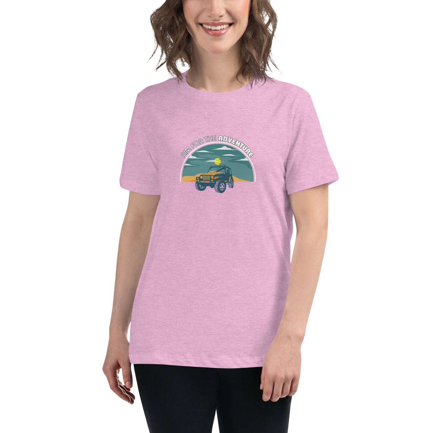 Woman smiling in a heather lilac relaxed t-shirt with 'Aim for the Adventure' and a vintage camper graphic