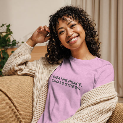 Woman wearing a heather prism lilac relaxed tee with "Breathe Peace, Exhale Stress" printed.