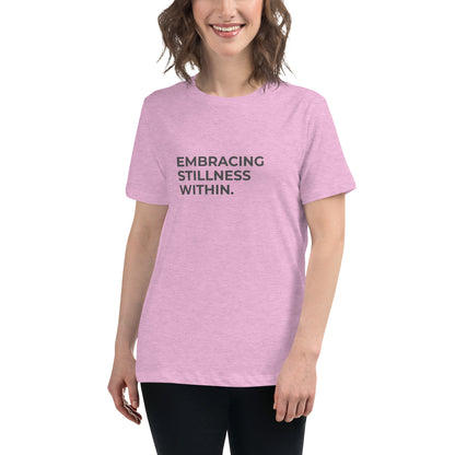 Woman wearing a heather prism lilac relaxed tee with "Embracing Stillness Within" printed.