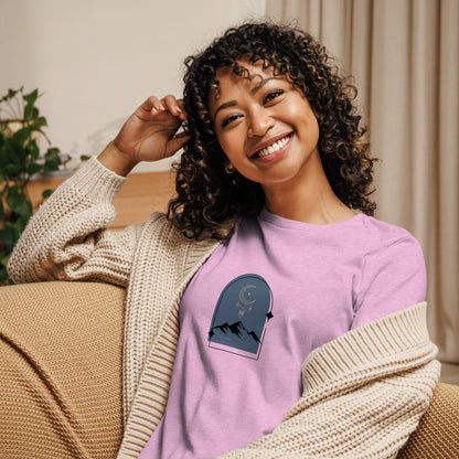 Woman wearing a heather prism lilac relaxed tee with a tranquil night sky graphic design, representing comfortable and authentic fashion by BYOL.