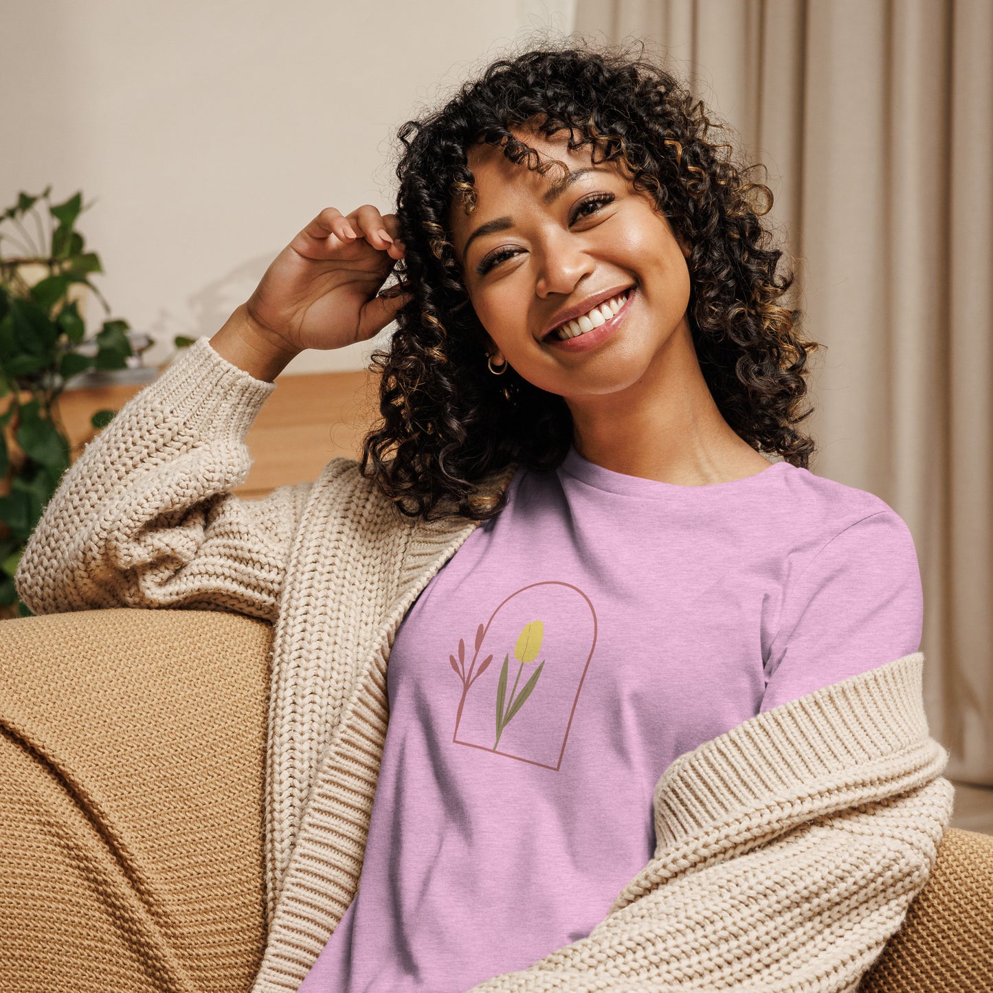 Woman wearing a heather prism lilac relaxed tee with a minimalist tulip window graphic design, representing comfortable and authentic fashion by BYOL.