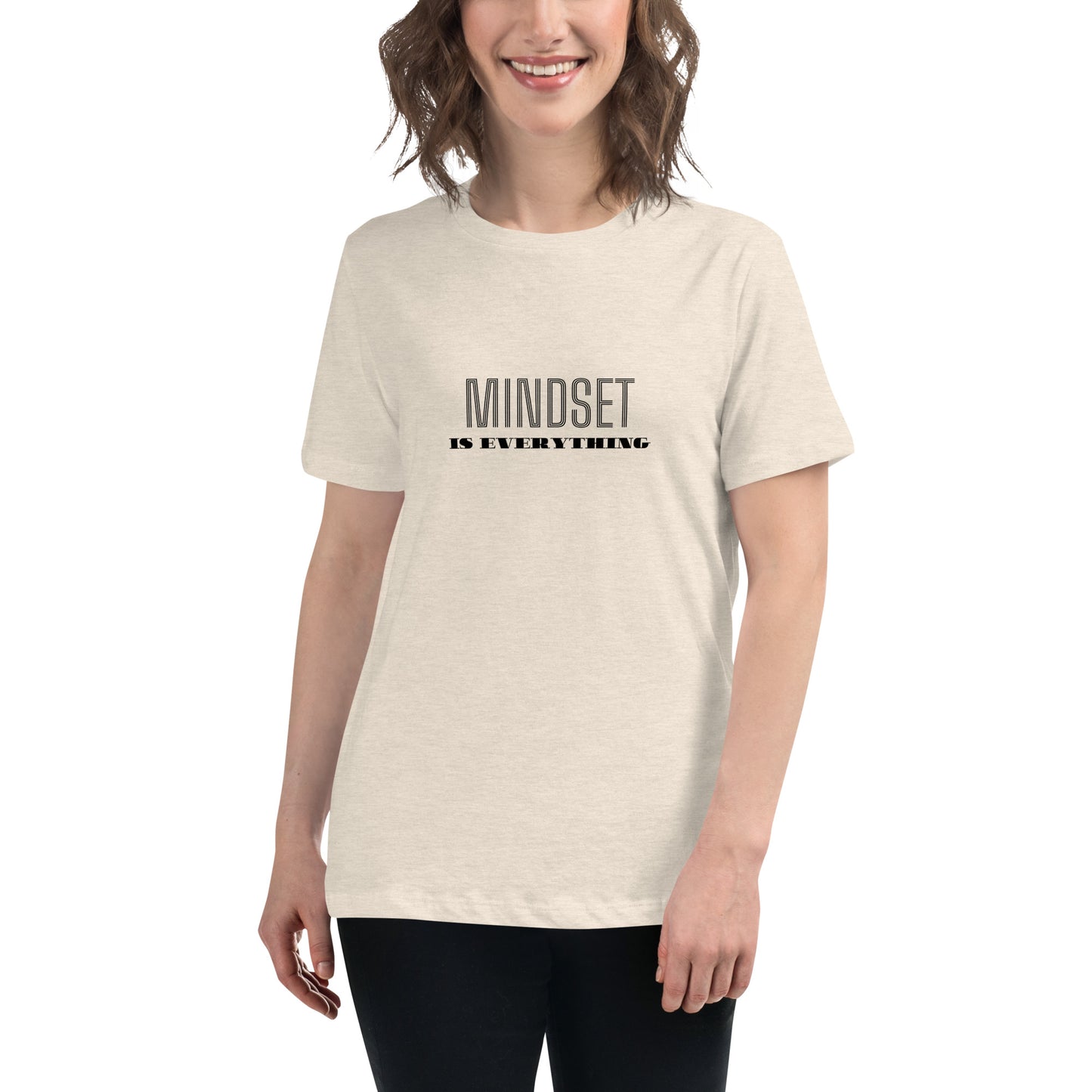 Woman wearing a heather natural relaxed t-shirt with the phrase "Mindset is Everything" printed in black.