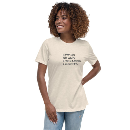 Woman wearing a citron relaxed tee with "Letting Go and Embracing Serenity" printed, available in various colors and sizes from S-3XL.