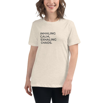 Woman wearing a heather prism natural relaxed tee with "Inhaling Calm, Exhaling Chaos" printed.