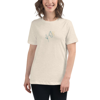 Woman wearing a heather prism natural relaxed tee with a minimalist flower graphic design, embodying comfortable and authentic fashion by BYOL.