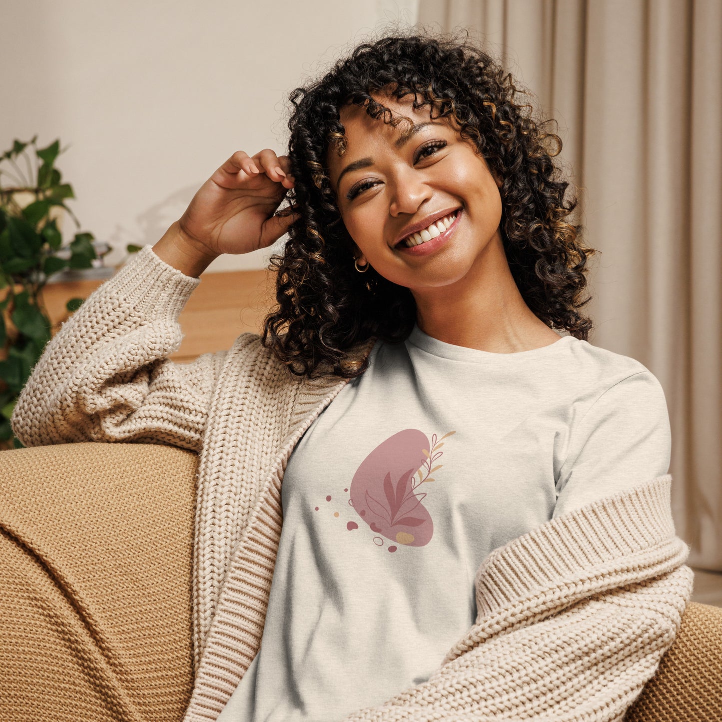 Woman wearing a heather prism natuta relaxed tee with a subtle abstract floral graphic design, embodying comfortable and authentic fashion by BYOL.