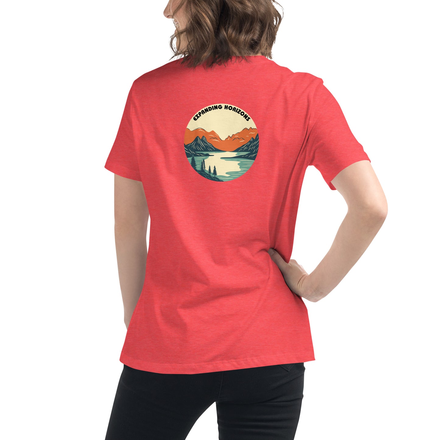 Woman wearing a heather red relaxed t-shirt featuring a scenic mountain and lake design with 'Expanding Horizons' text