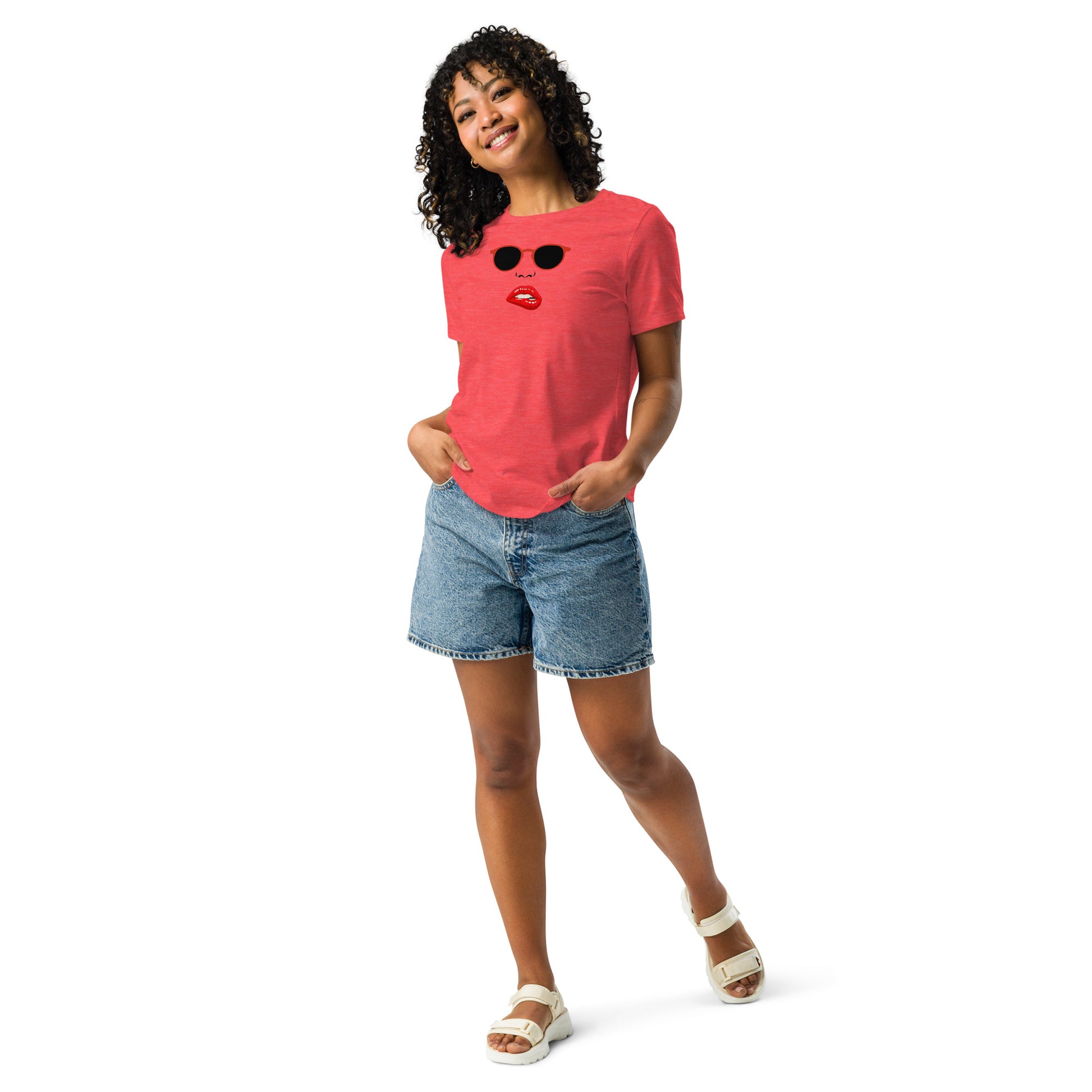 Woman in a heather red relaxed t-shirt featuring an edgy red lips and sunglasses design, embodying quirky and playful fashion.