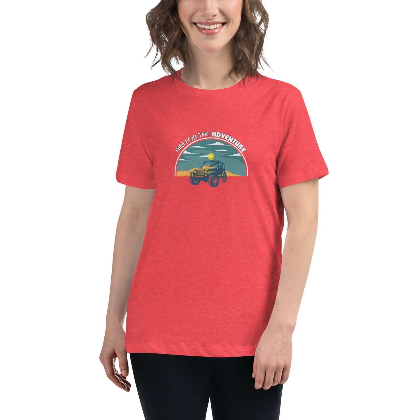 Woman smiling in a heather red relaxed t-shirt with 'Aim for the Adventure' and a vintage camper graphic