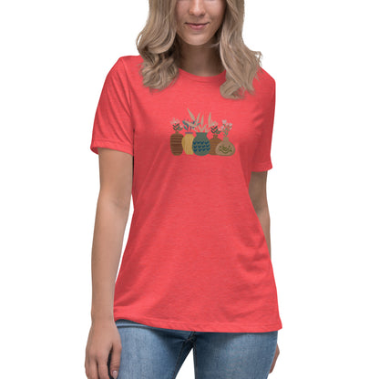 Woman wearing a heather red relaxed tee with a charming vase floral graphic design, embodying comfortable and authentic fashion by BYOL.