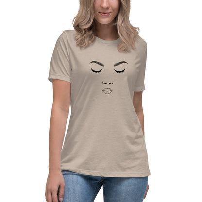 Woman wearing a stone relaxed t-shirt featuring a minimalist face design