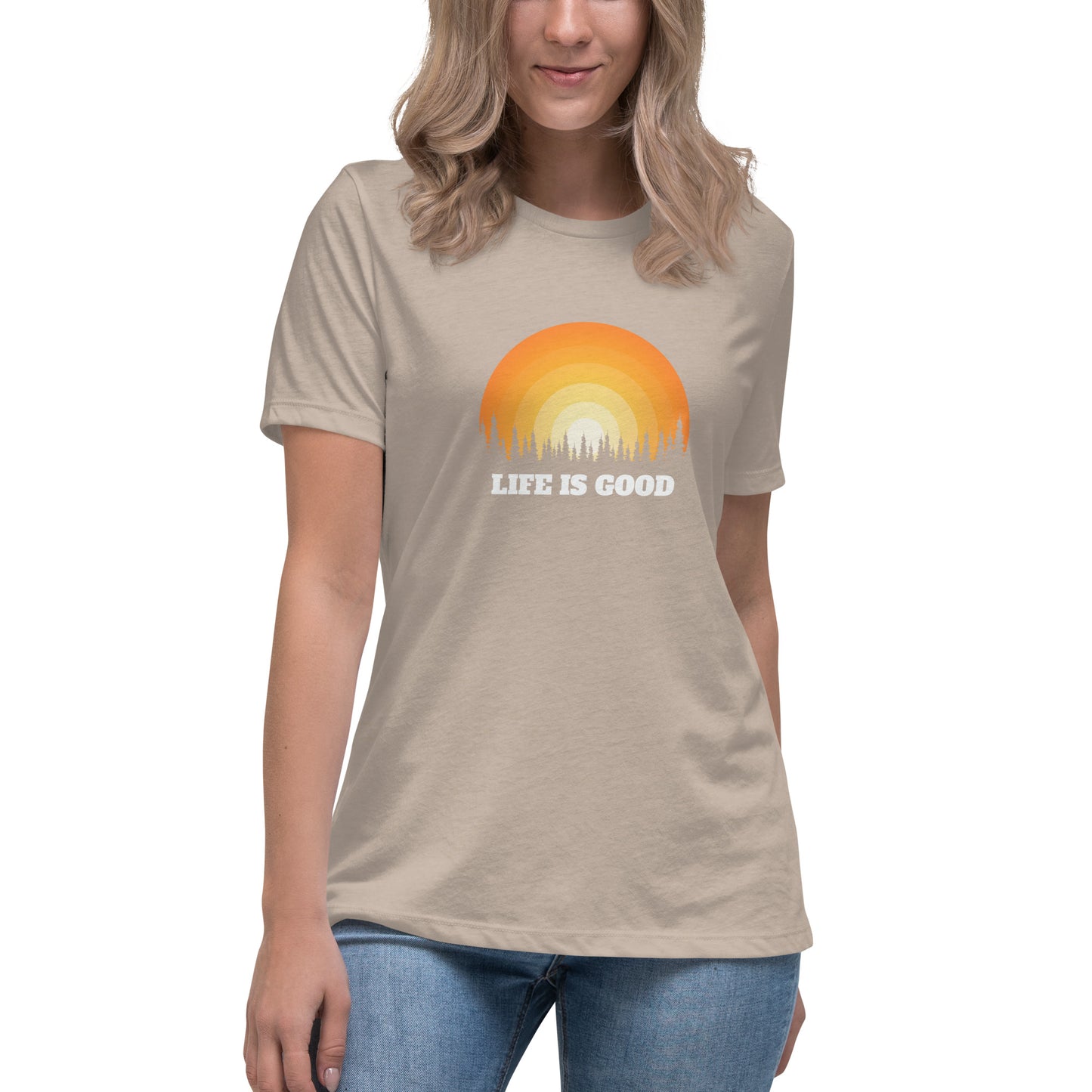 Woman in heather stone relaxed t-shirt with 'Life Is Good' sunset graphic