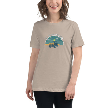 Woman smiling in a stone relaxed t-shirt with 'Aim for the Adventure' and a vintage camper graphic