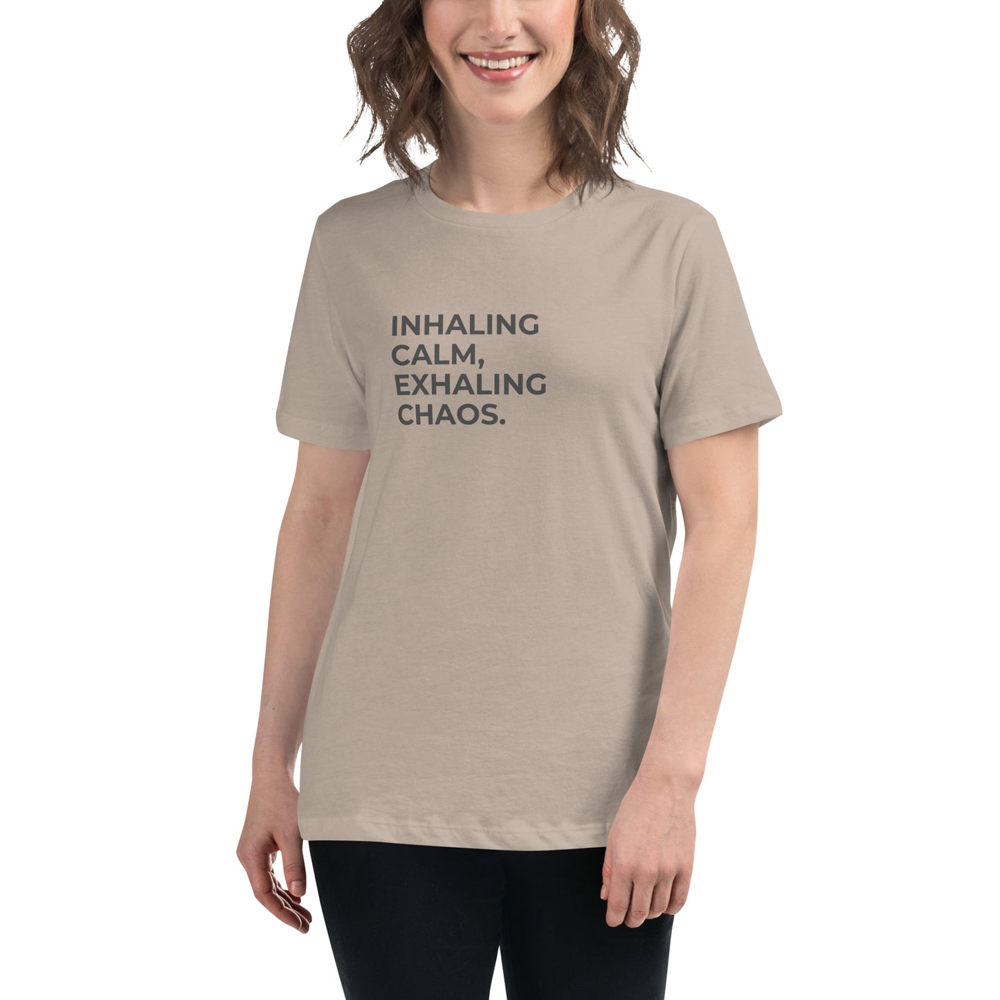 Woman wearing a heather stone relaxed tee with "Inhaling Calm, Exhaling Chaos" printed.