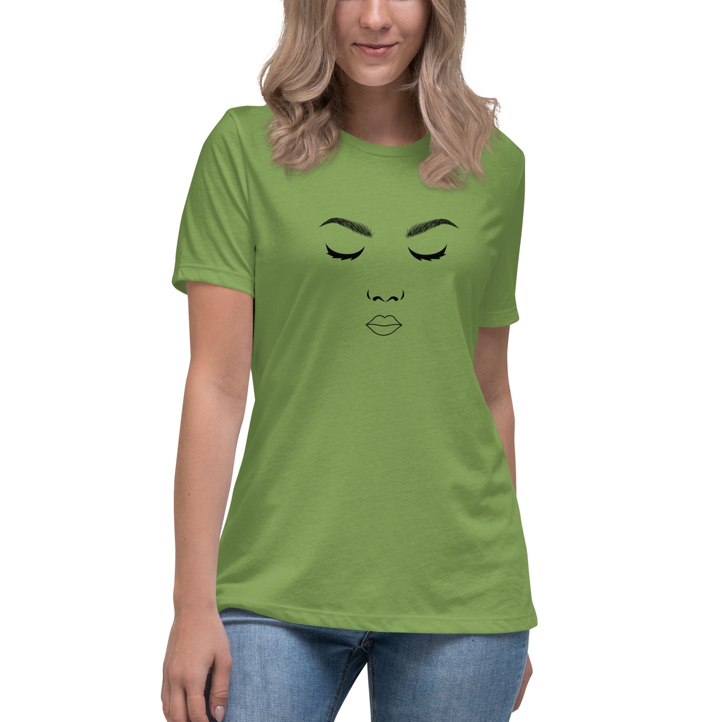 Woman wearing a leaf green relaxed t-shirt featuring a minimalist face design