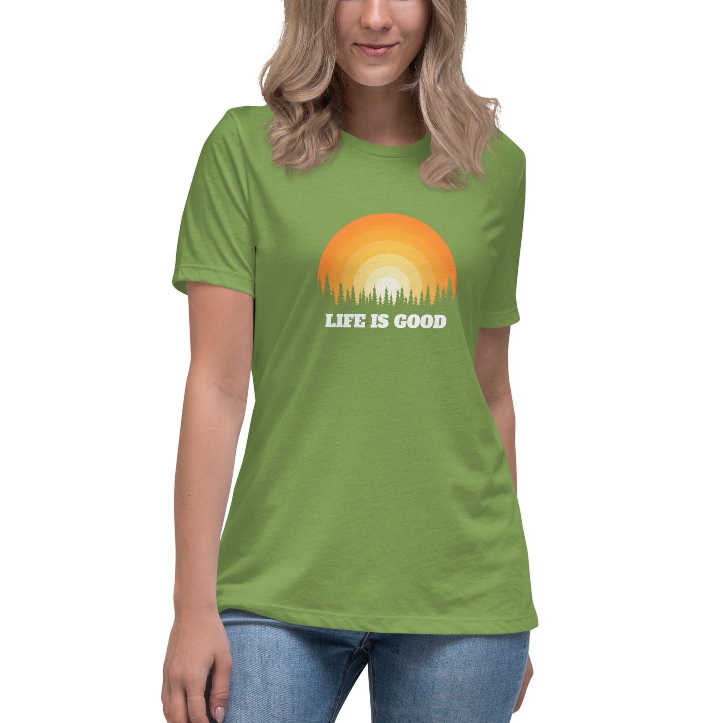 Woman in leaf green relaxed t-shirt with 'Life Is Good' sunset graphic