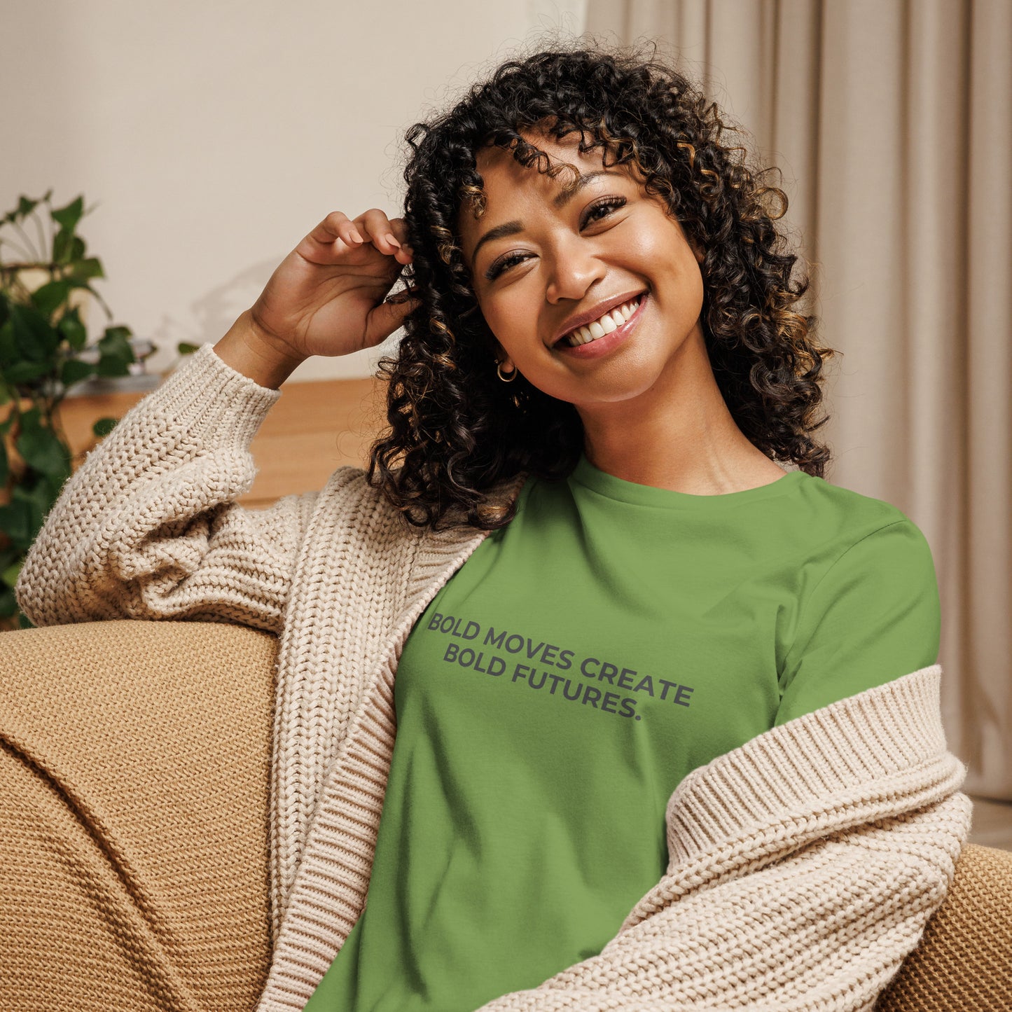 Woman wearing a leaf relaxed tee with "Bold Moves Create Bold Futures" printed.