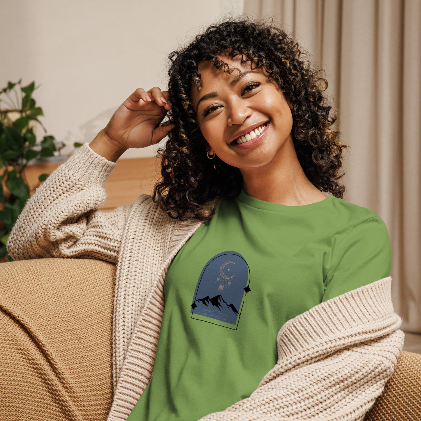 Woman wearing a leaf relaxed tee with a tranquil night sky graphic design, representing comfortable and authentic fashion by BYOL.