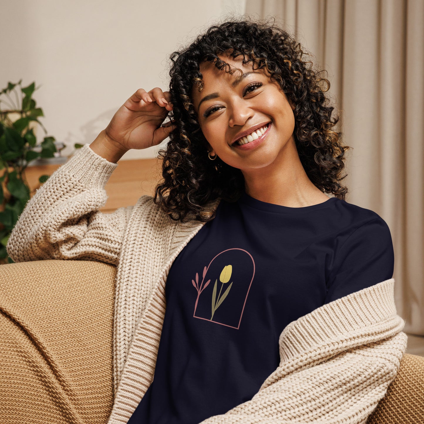 Woman wearing a navy relaxed tee with a minimalist tulip window graphic design, representing comfortable and authentic fashion by BYOL.