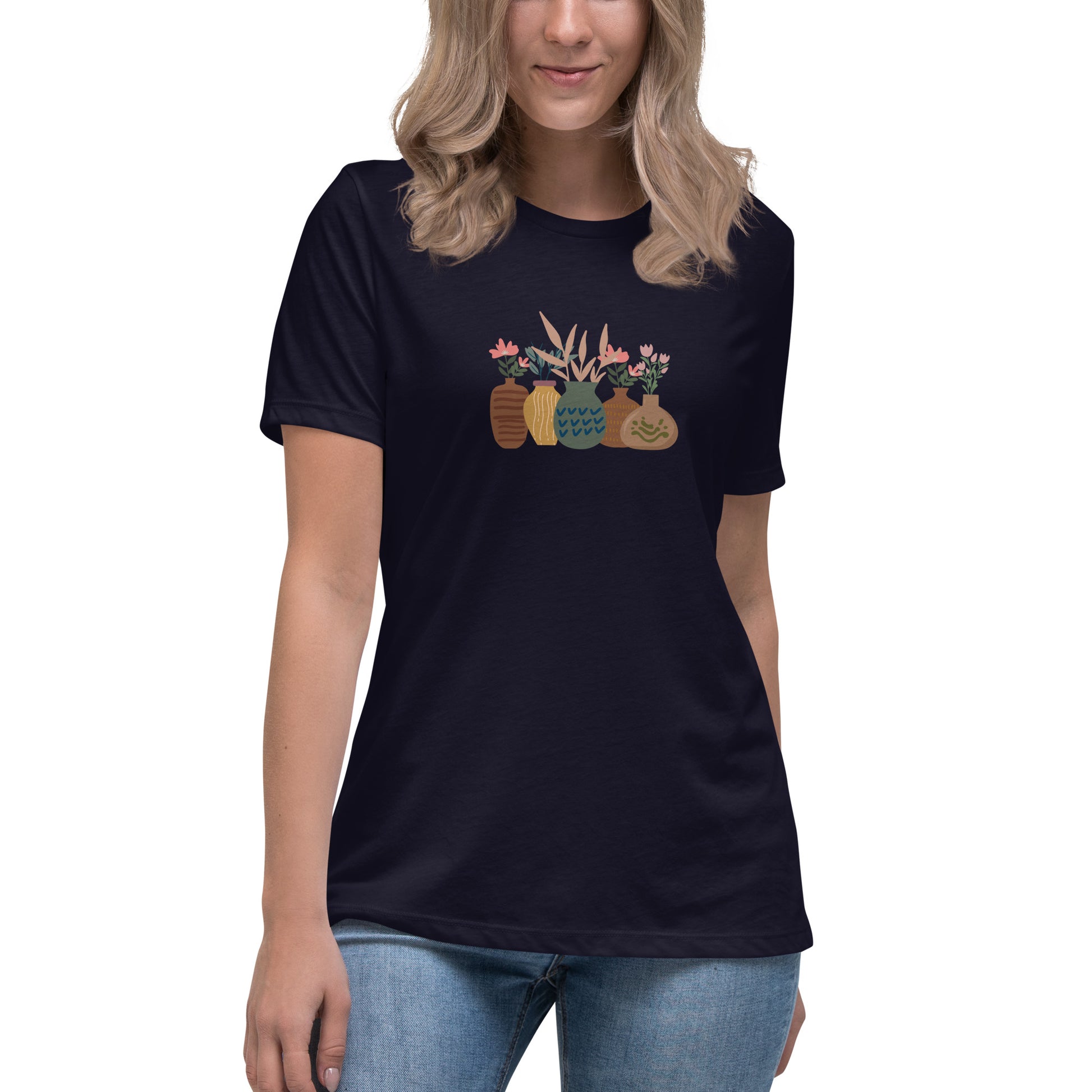 Woman wearing a navy relaxed tee with a charming vase floral graphic design, embodying comfortable and authentic fashion by BYOL.