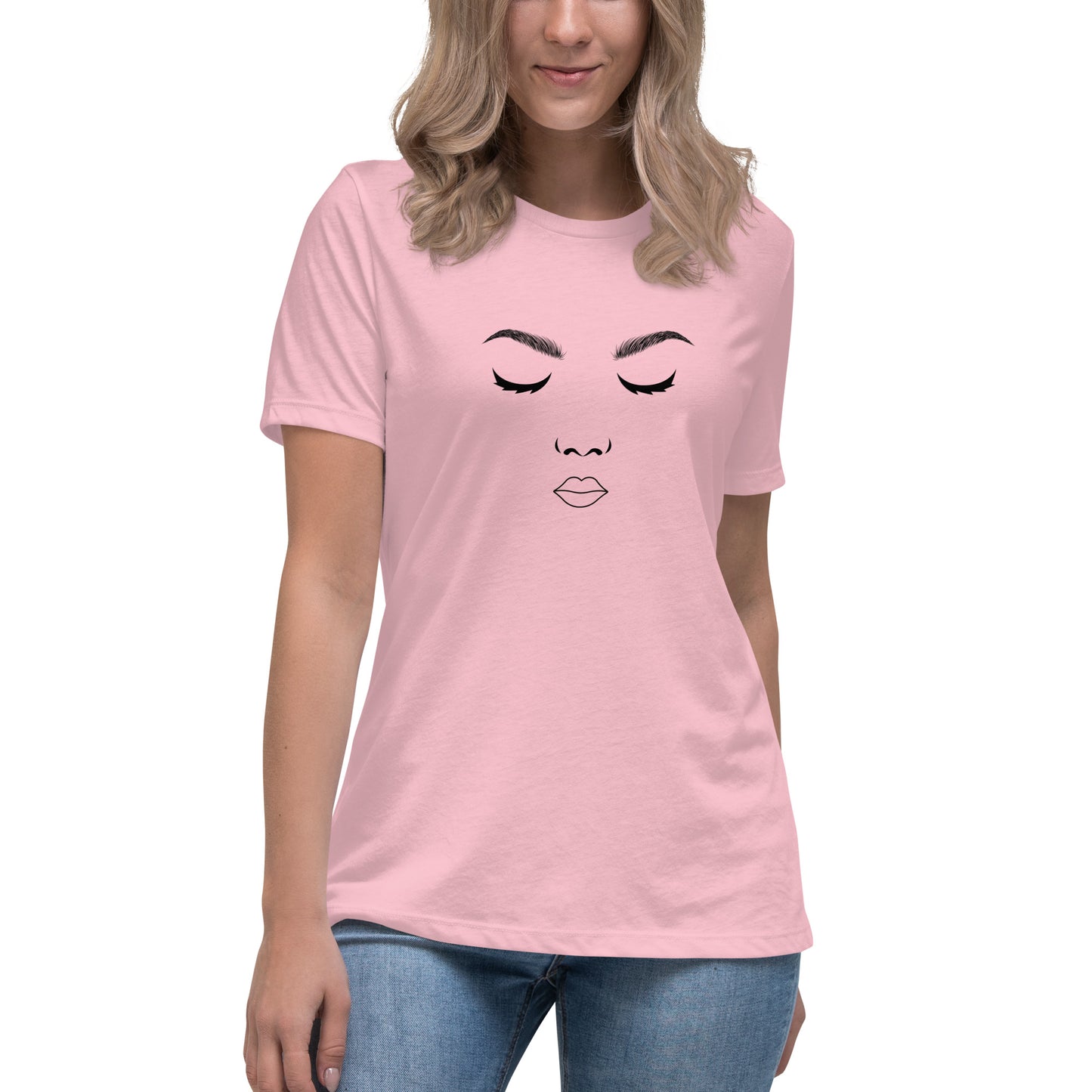 Woman wearing a heather pink relaxed t-shirt featuring a minimalist face design