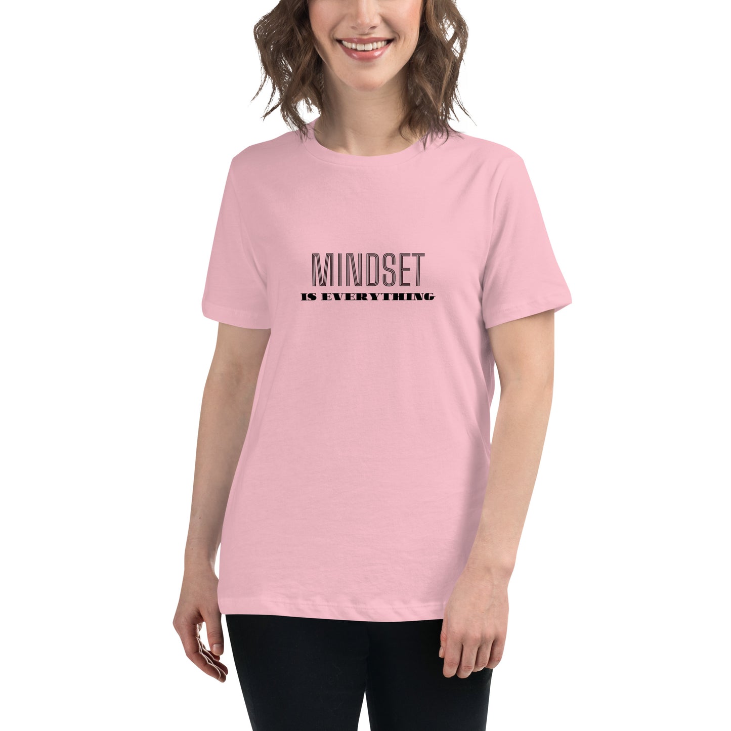 Woman wearing a pink relaxed t-shirt with the phrase "Mindset is Everything" printed in black.